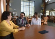 Three people sitting at a table