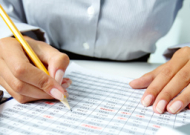 hands over a spreadsheet