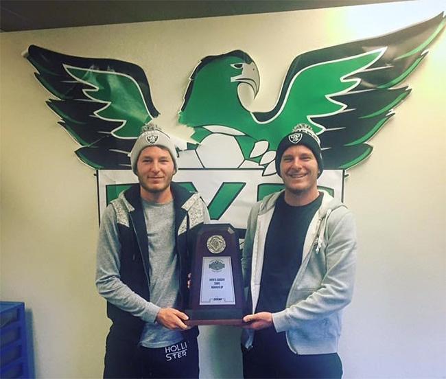 Frankie and Tommie holding an award