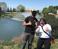 Two students with a thumbs up sign
