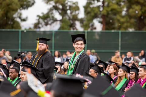 Student smiling at the Graduation Day Ceremony