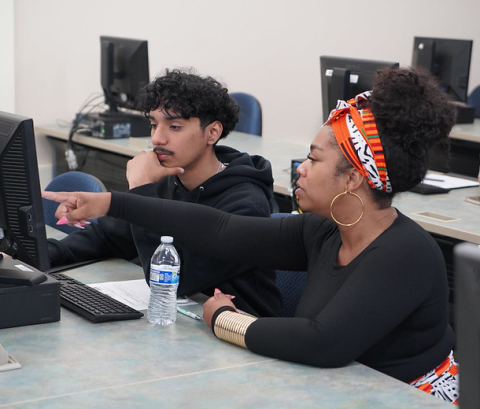 Counselor assisting a high school student