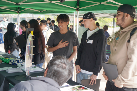 High School Seniors at one of the programs information table