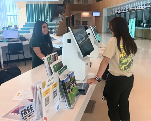 student at welcome desk