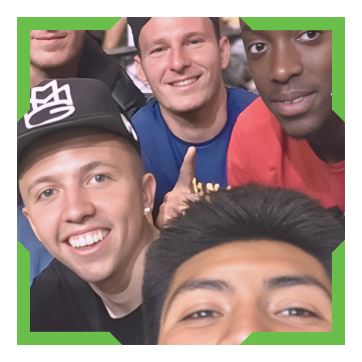 Group of male students smiling.