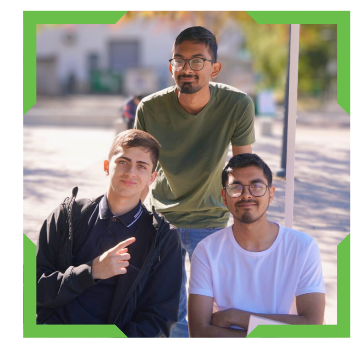 Group of male students smiling into camera.